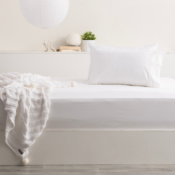 alt="A luxurious white bed with soft bamboo cotton blend sheets and pillowcases, offering a silky smooth feel and unique sheen. Highly breathable and durable, providing a comfortable and irritation-free sleeping experience. "