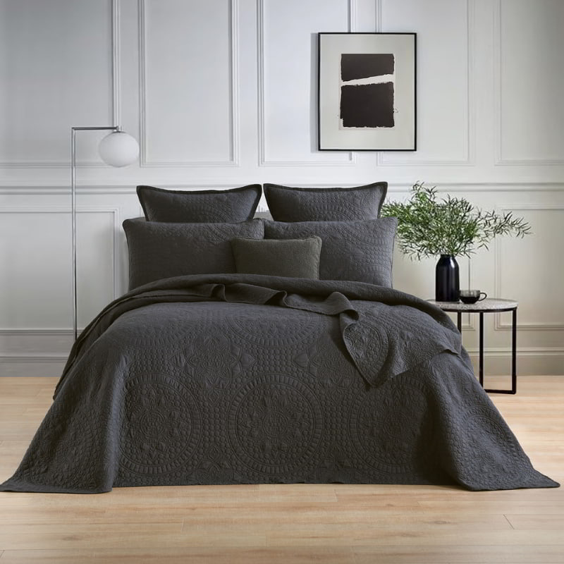 alt="A grey european pillowcase and quilt cover features an inspiration from the ornate detailing of traditional Greek tile patterns in a luxurious bedroom.