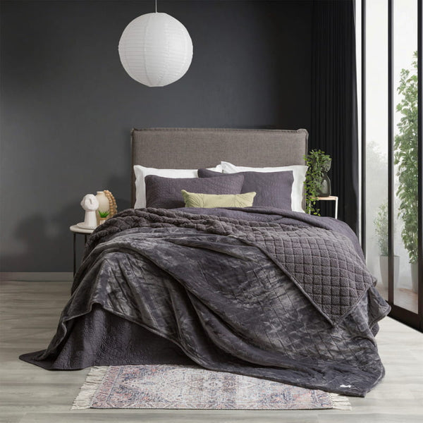  A cozy bedroom featuring graphite colour ultra soft velvet blanket with a diamond pattern and clean edge.