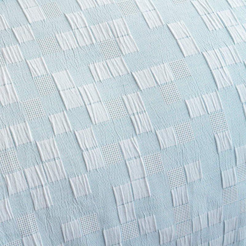 alt="Close-up details of a french blue european pillowcase featuring a check pattern"