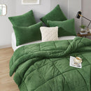 The Morgan and Reid Jungle Snuggle Fleece Pillowcase Pair features a rectangular green design with plush texture and slightly rounded corners, crafted from soft snuggle fleece, shown on a plain white background.