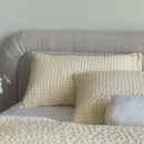 A spanning close up video of the yellow checked comforter