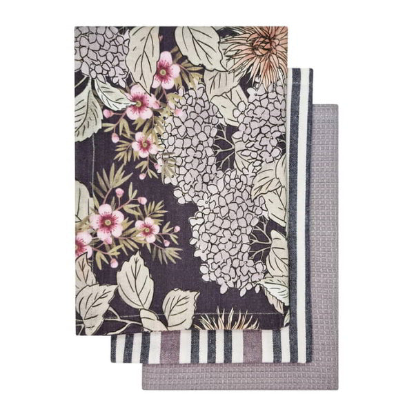 alt="3 pieces of dark grey tea towels feature one printed design, one striped design and one plain waffle."