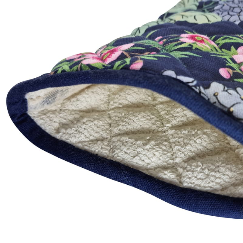 alt="Close-up details of a navy oven mitt featuring beautiful flowers and colours of a summer garden"