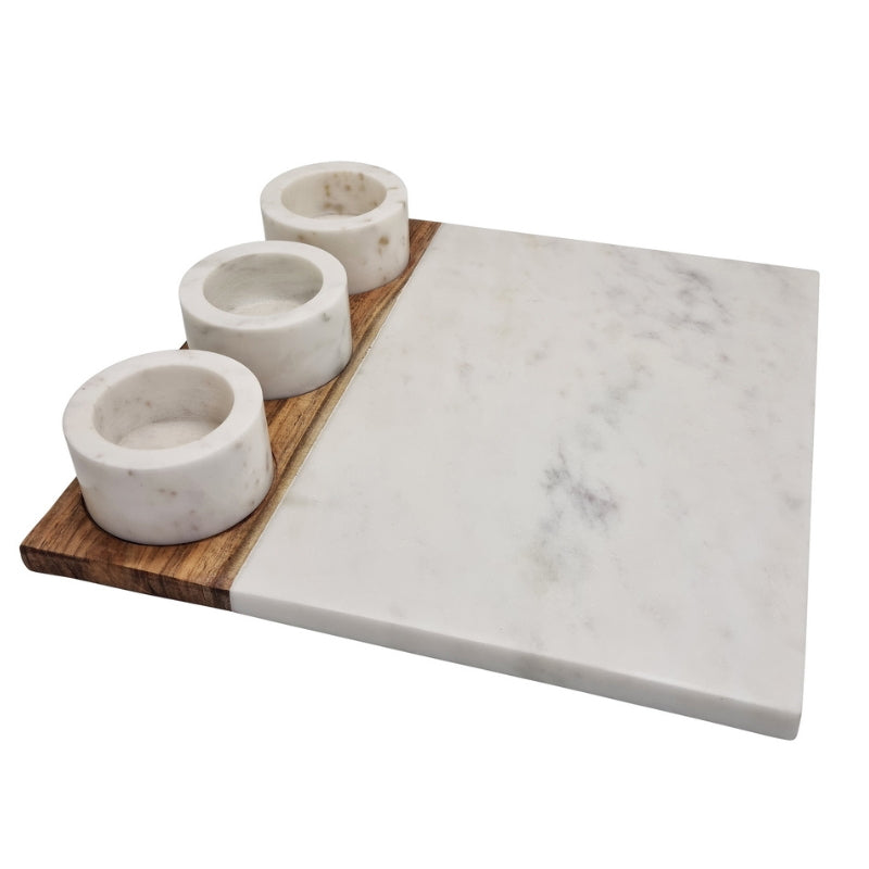 alt="Side view of serving board with dip bowls rafted from a combination of gorgeous white marble with an acacia wood accent."