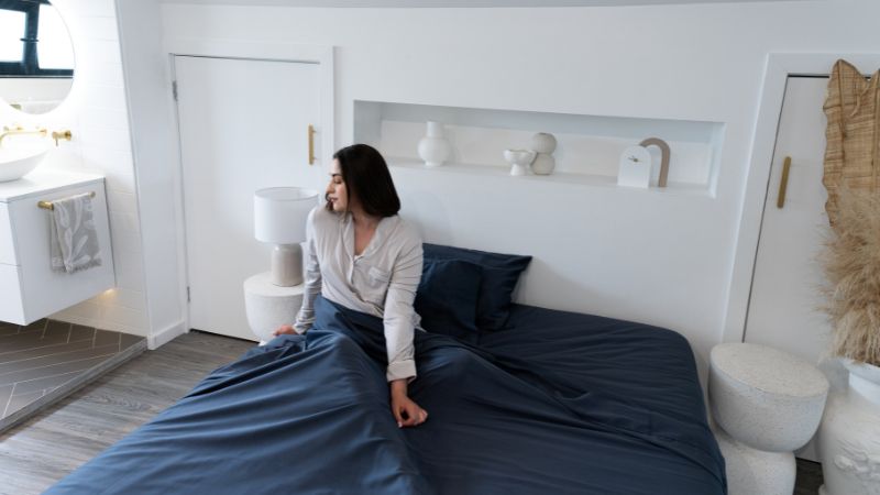 Women in bed with dark charcoal bamboo sheets