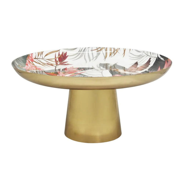 alt="A gold cake stand featuring a vibrant array of tropical birds surrounded by lush foliage"