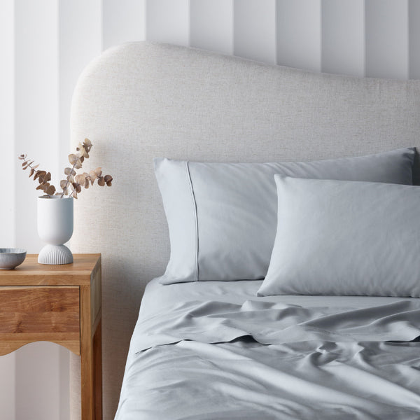 alt="A grey cotton rich sheet set in a luxurious bedroom"