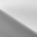 Close-up of soft, sateen weave texture in the grey coverlet with folded edges and smooth finish