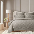 Accessorize coverlet set in natural colour displayed with matching cushions on bed
