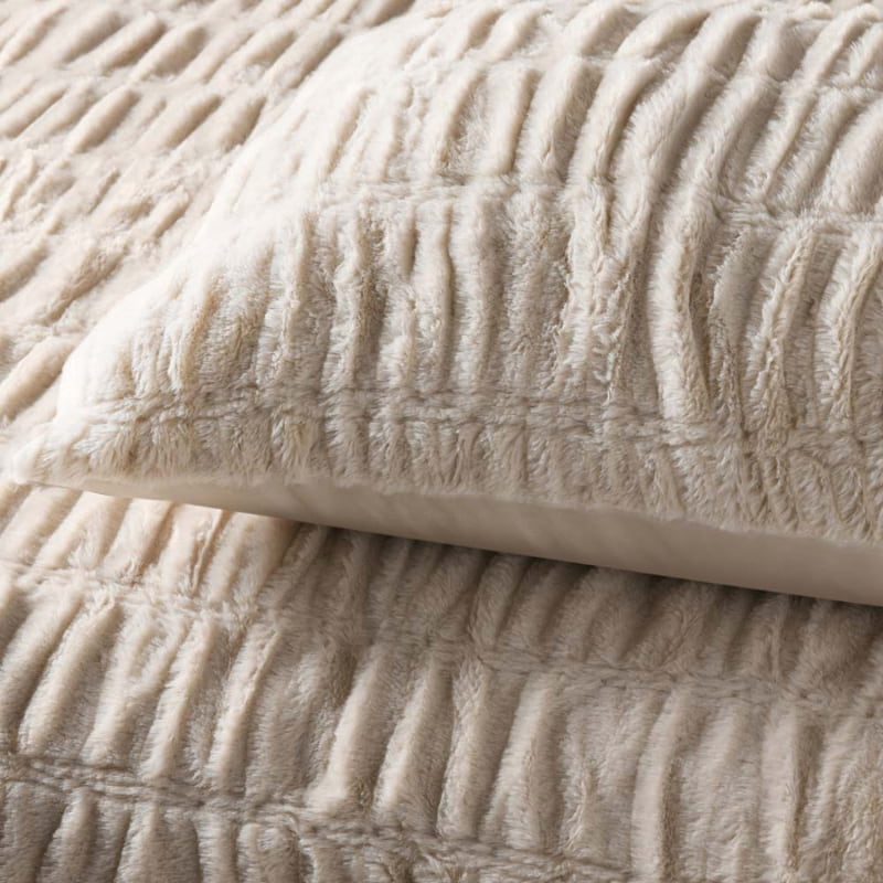 alt="Zoom in details of a natural quilt cover set highlighted further with subtle ruching and texture along with the pillowcases"