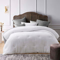 Textured jacquard comforter set in classic white with clipped dot detail, and polyester filled with quilting for warmth.