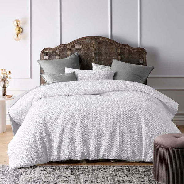 Unique texture of jacquard quilt cover set with clipped dot detail, a beautiful update to white bedding.