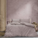 A cosy mauve quilt cover set featuring a subtle geometric embossed pattern.