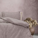 A cosy mauve quilt cover set featuring a subtle geometric embossed pattern.