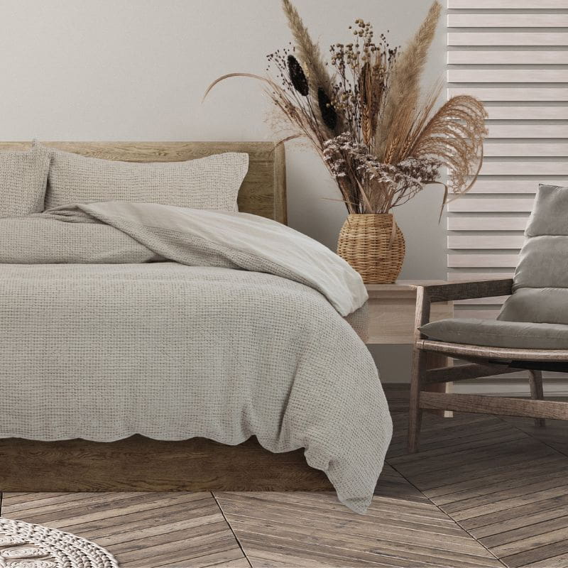 Experience of the cosy charm of the natural quilt cover set featuring a vintage cotton design with textured waffle for added depth and warmth.