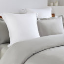 Zoom in details of the elegant bed with silver quilt cover set and fitted sheet, featuring Amor 400 Thread Count for ultimate comfort.