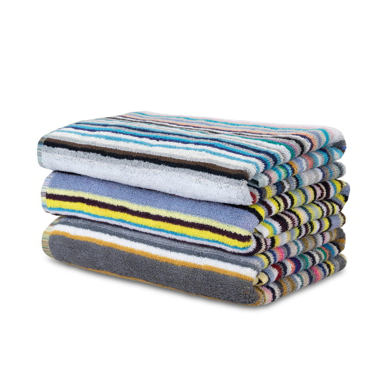 A vibrant, eco-friendly beach towel featuring multicoloured stripes, perfect for summer outings and stylish picnics.
