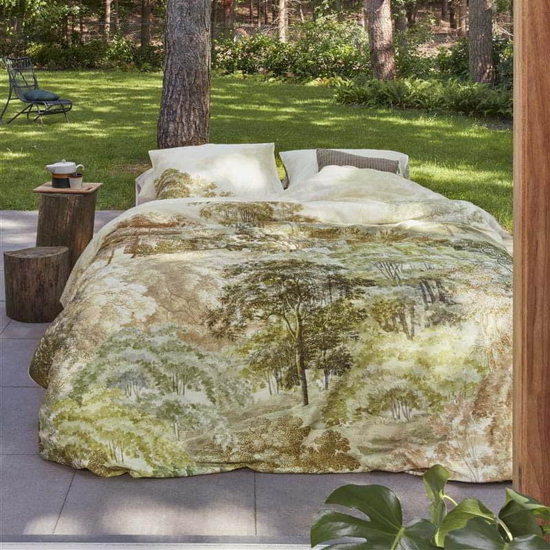 alt="A quilt cover set designed with an idyllic hand-painted landscape of wooded hills with trees"