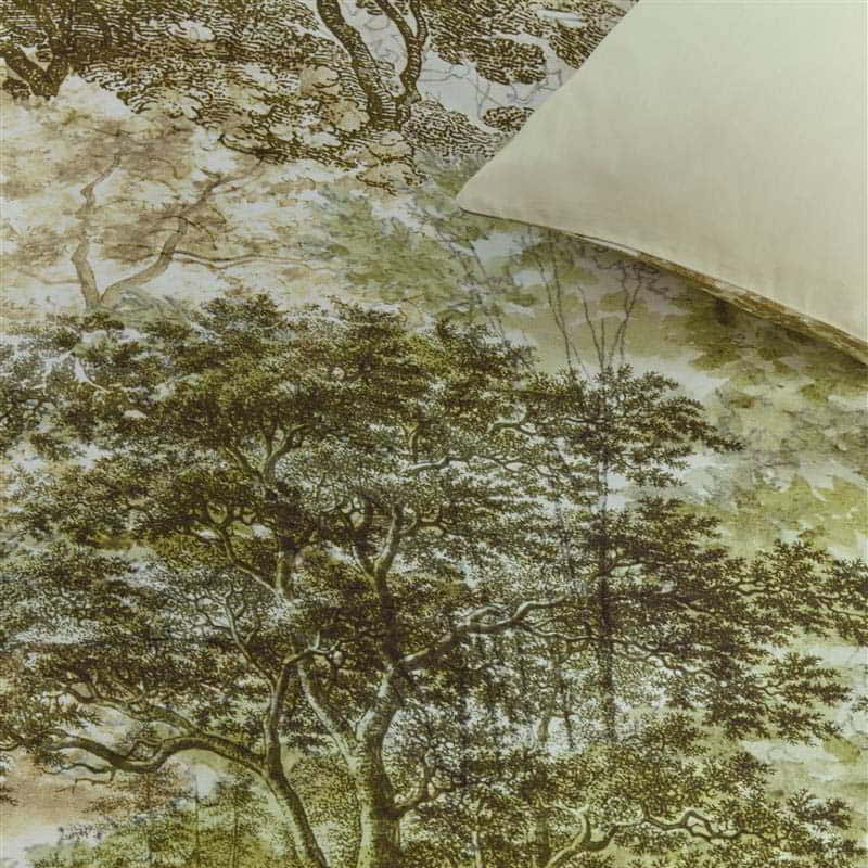 alt="Close-up look of a quilt cover set designed with an idyllic hand-painted landscape of wooded hills with trees"