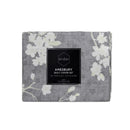  The elegant Amesbury natural quilt cover set in floral print, presented in its front packaging for display.