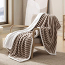 Boucle throw styled on a lounge with plush sherpa reverse