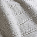 Close-up details of a natural tone quilt cover set designed with delicate marle accents and a rustic, tactile design.