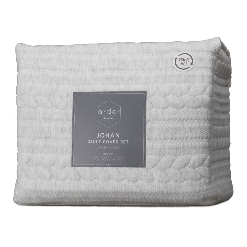 Packaging details of a natural tone quilt cover set designed with delicate marle accents and a rustic, tactile design.