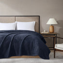 Ardor Boudoir Teddy Navy Blanket draped across a bed with soft rippling texture