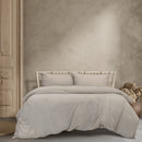  A luxurious bed featuring an elegant Ardor Boudoir Vintage Washed Grey Quilt Cover Set.