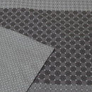 A close-up view of a grey and black checkered patterned sheet, showcasing its elegant design and soft texture.