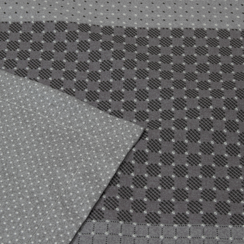A close-up view of a grey and black checkered patterned sheet, showcasing its elegant design and soft texture.
