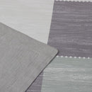 Closer look of a multicoloured quilt cover, highlighting its classic check pattern.