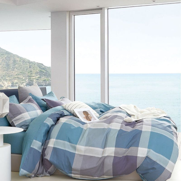This quilt cover set is designed with a soft blues and muted purples in a layered check pattern with subtle textured detail.