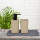 A bathroom sink featuring a soap dispenser and soap dish, complemented by the stylish Ardor DRI Stone Sink Mat for cleanliness.