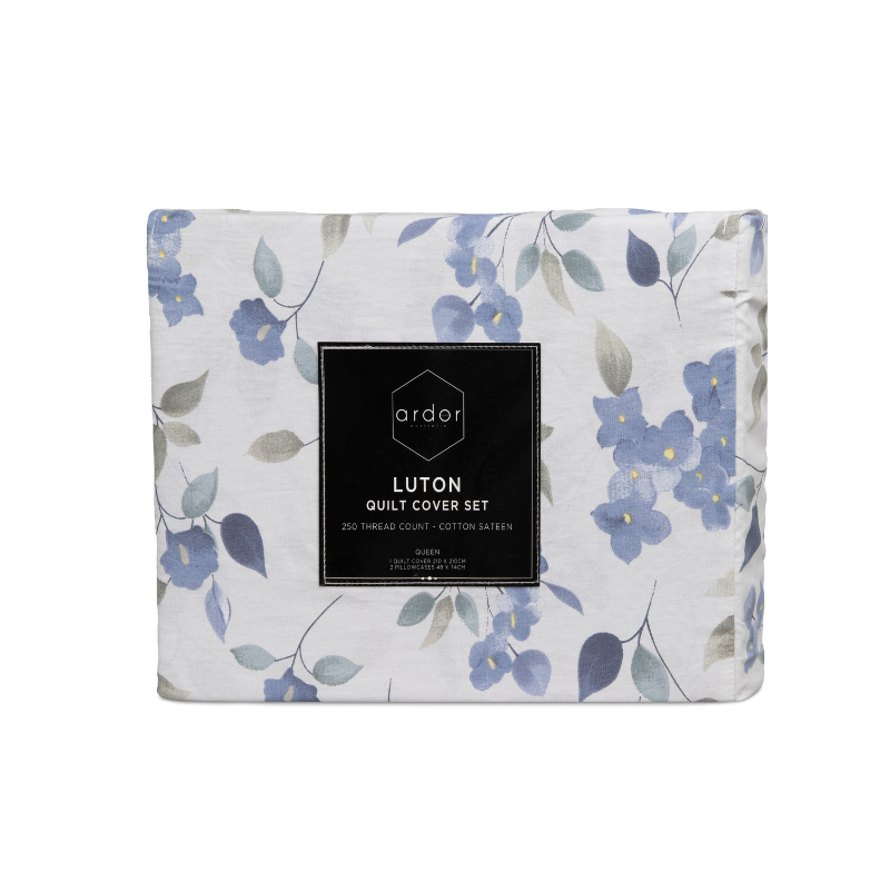 Front packaging of blue and white floral cover set. Exuding elegance and tranquility in a serene bedroom setting.