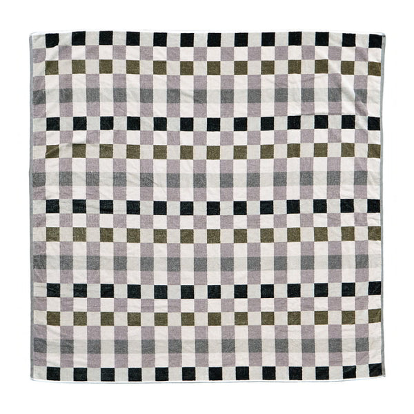 A multi coloured checkered beach blanket on a white background, showcasing a stylish and classic pattern.