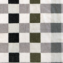 Detailed view of the multi coloured checkered beach blanket on a white background, showcasing a stylish and classic pattern.
