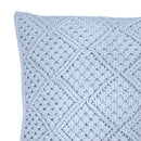 alt="Close-up view of a blue macrame diamond pattern square cushion"