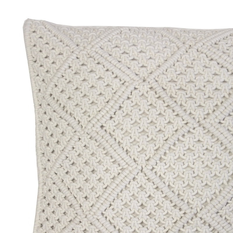 alt="Close-up view of an ivory macrame diamond pattern square cushion"