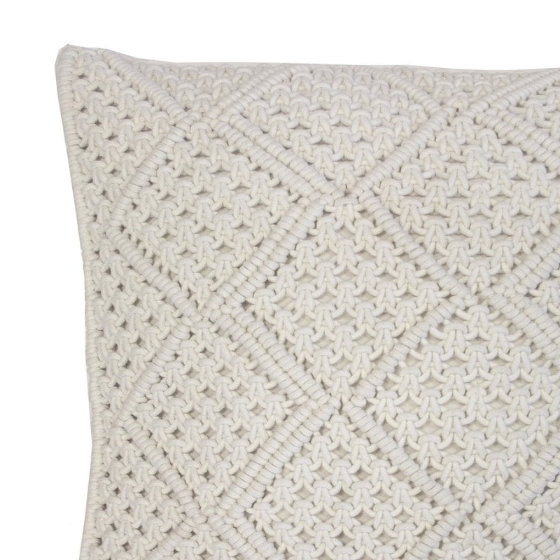 alt="Close-up view of an ivory macrame diamond pattern square cushion"