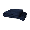 Folded navy chenille throw showing soft texture and tasselled edge