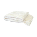 Folded white chenille throw showing soft texture and tasselled edge