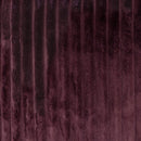 Close-up of soft velour fabric in deep plum tone