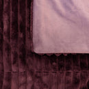 Detail of plum velour front and soft fleece reverse fabric
