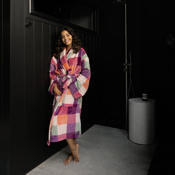 Woman wearing the Bambury Charlie Ultraplush Sherbet Robe standing barefoot outdoors, smiling and relaxed