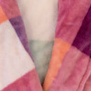 Close-up of the robe’s soft plush texture and sherbet-inspired check design