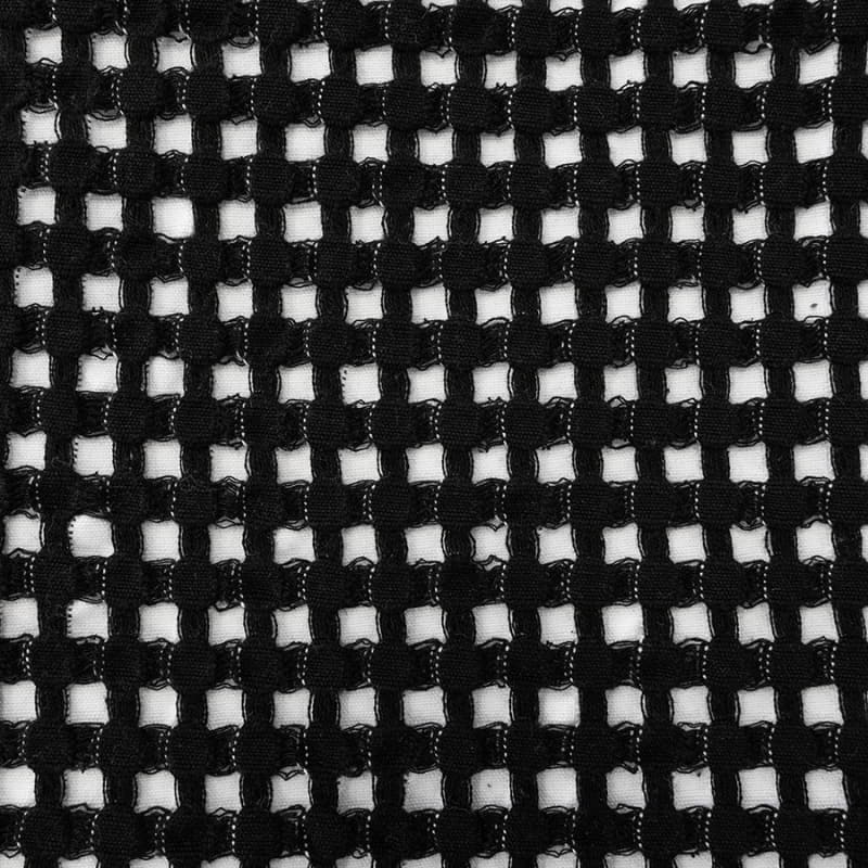 A close-up view of the Dora Black cushion, made from soft waffle fabric for a stylish and cosy touch.