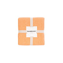 An elegant packaging of Dora Peach Throw, ideal for enhancing comfort and decor in your home.