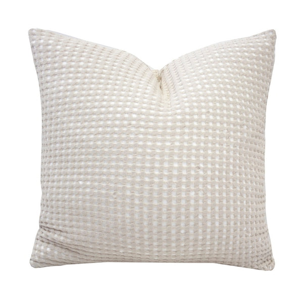 alt="Square cushion in two-tone white and ivory waffle fabric"